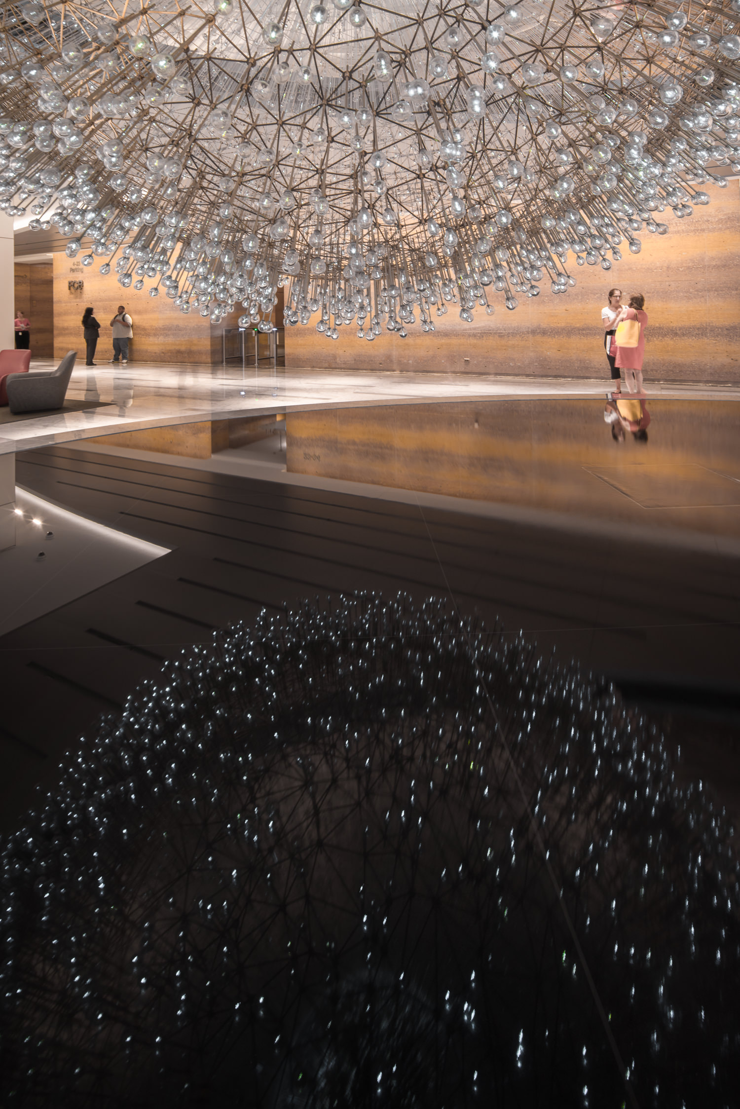 mirroring the sculpture lucent chicago by mark hadden 